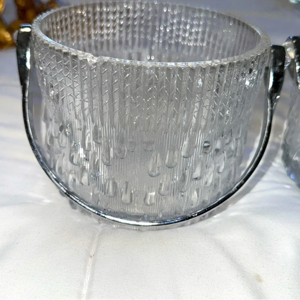 Set of two texture glass ice buckets or votive holders with chrome handles. 2